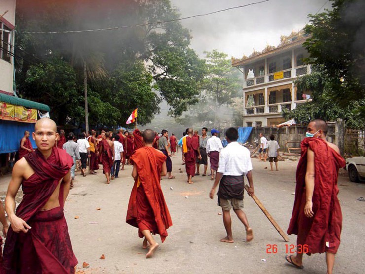 epa01131445 Monks and civilians gather in a street in Yangon ( Rangoon ) Myanmar, ( Burma ) 26 September 2007. Myanmar troops used batons and tear gas Wednesday to keep tens of thousands of marching monks and their layman followers out of Yangon&apos;s holiest shrines in a standoff between rifles and rust-coloured robes that is expected to end in bloodshed. Barricaded police and soldiers beat monks and laymen back from the east gate of the Shwedagon Pagoda with batons and tear gas twice Wednesday afternoon, leaving dozens injured. There were unconfirmed reports of two monks dying in the melee. At least 30 monks and 50 civilians were taken away in military vehicles to an unknown destination. EPA/DEMOCRATIC VOICE OF BURMA / HO EDITORIAL USE ONLY